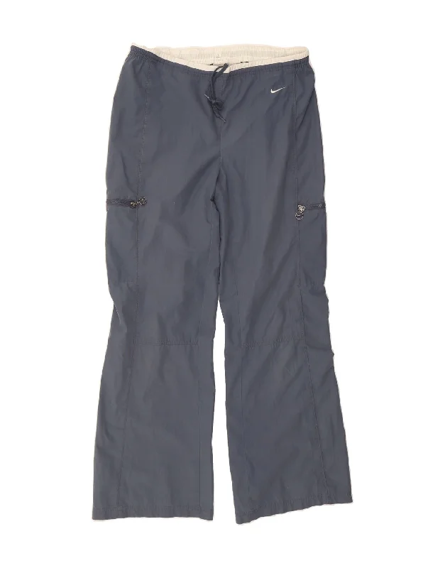 Trendy Dresses NIKE Womens Cargo Tracksuit Trousers UK 14/16 Large Blue Polyester